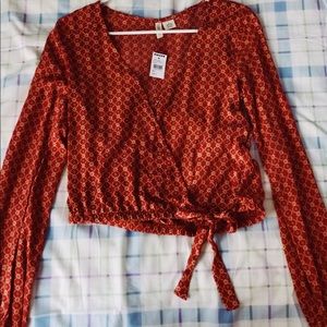 Red/ burgundy wrap top with small floral design